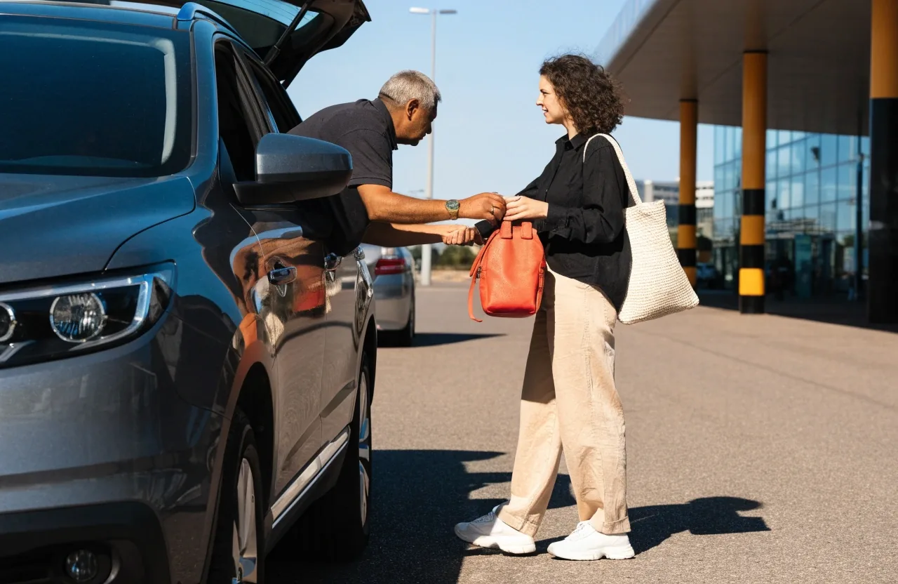 Rideshare pick-up lane with cars and travellers at Melbourne Airport