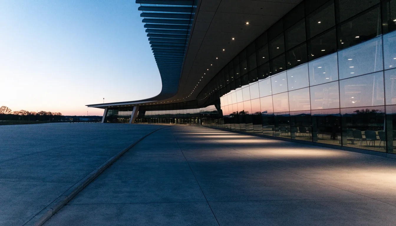 Terminal canopy over an empty airport forecourt at dusk