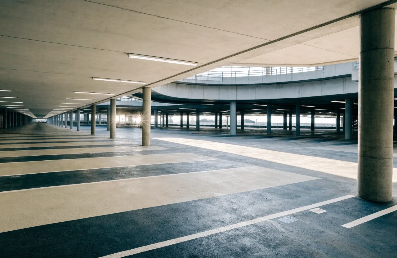 Empty car park deck with painted floor bands in daylight